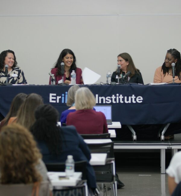 ACF & Erikson Institute panel of speakers sitting at large table facing the audience